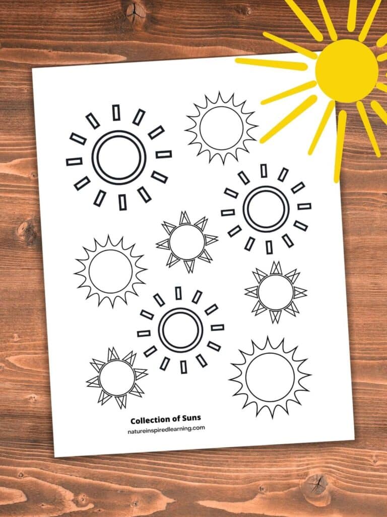 collection of suns coloring page with different sized suns in different designs on a wooden background. Bright yellow sun upper right corner.