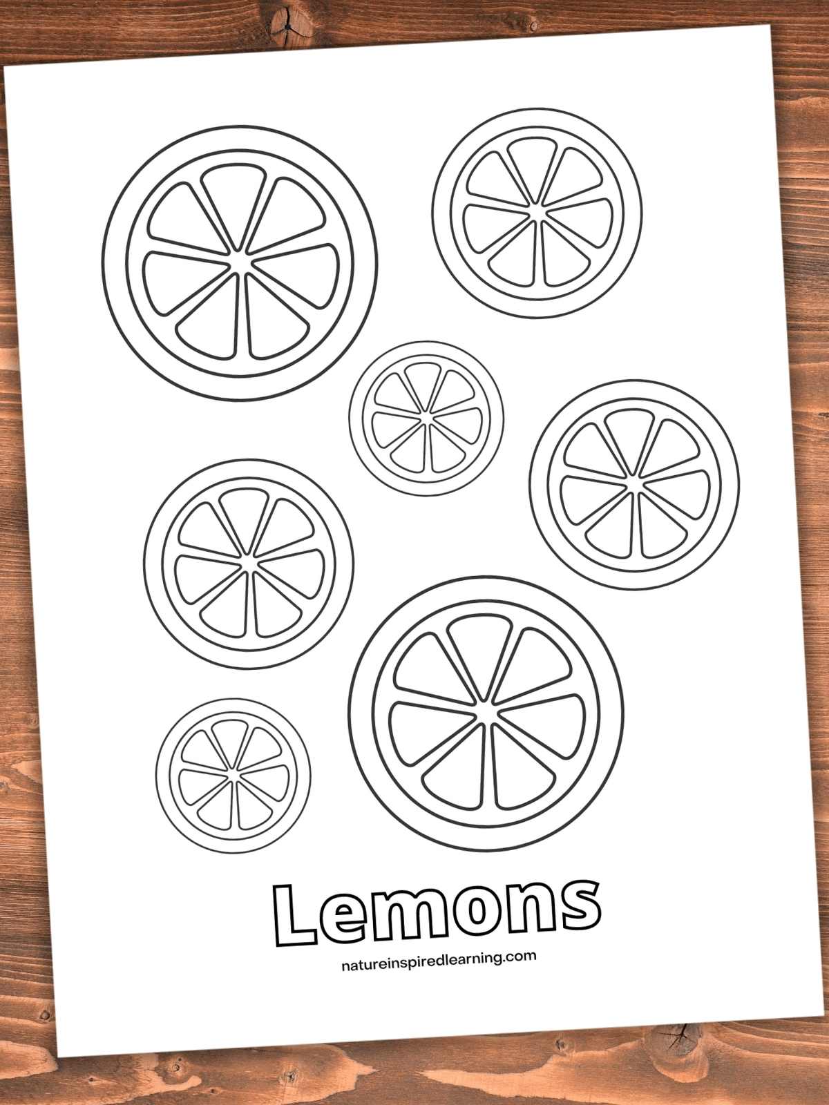 printable with circular lemon slices and word Lemon across bottom. Sheet on a wooden background