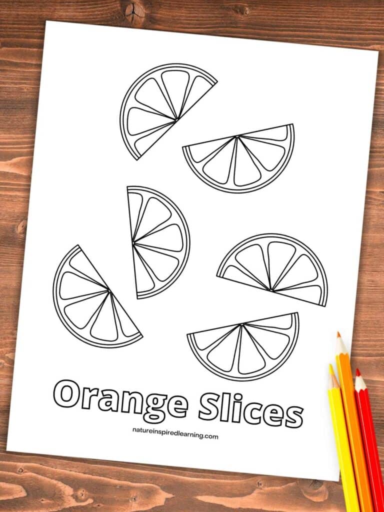 coloring page with orange slices on a wooden background with three colored pencils bottom right