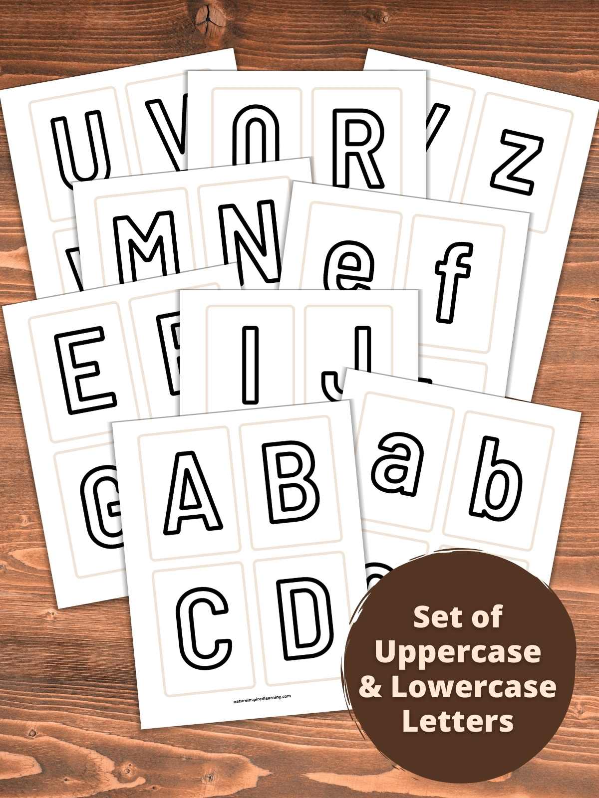 printed out set of uppercase and lowercase letters on flashcards overlapping on a wooden background. Dark brown circle bottom right with text overlay