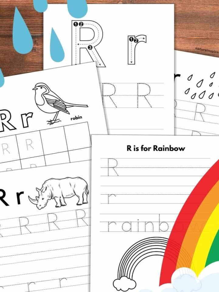 Five letter R tracing worksheets overlapping on a wooden background with blue raindrops upper left rainbow with cloud bottom right