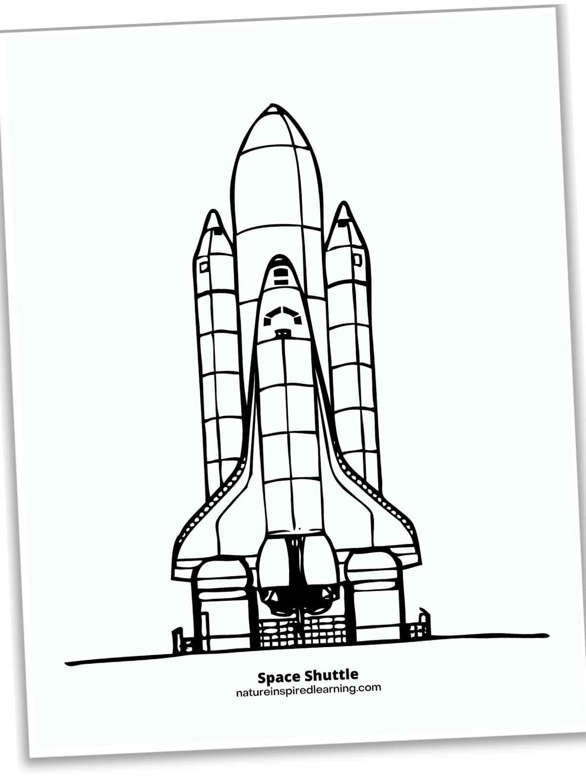 black and white space shuttle at a landing pad