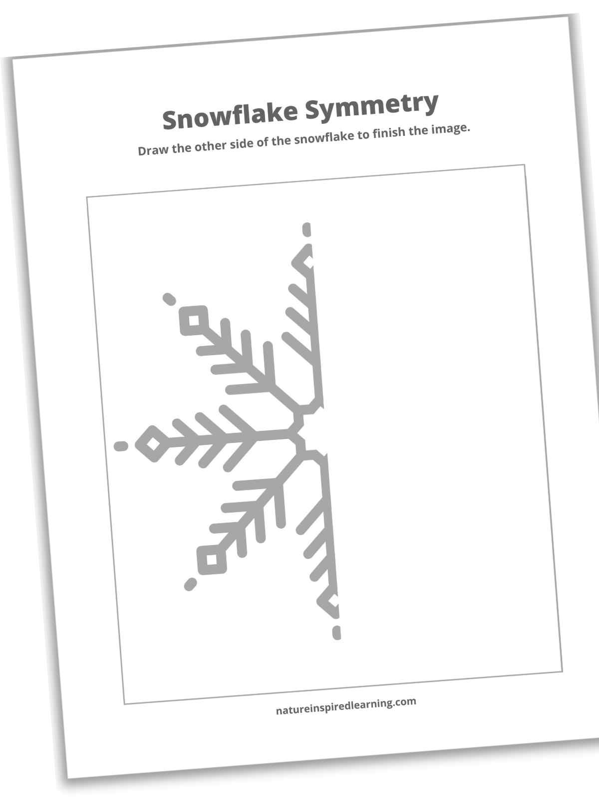 slanted black and white printable with half of a snowflake within a large square