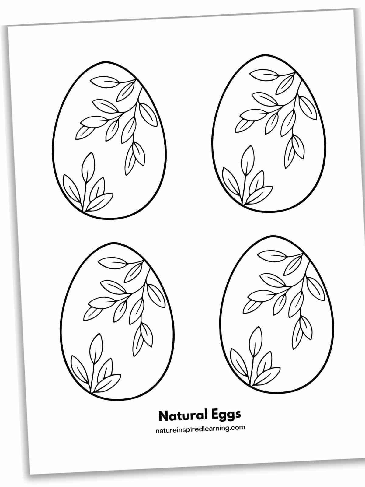 four eggs with leaf designs on each arranged in two rows of two