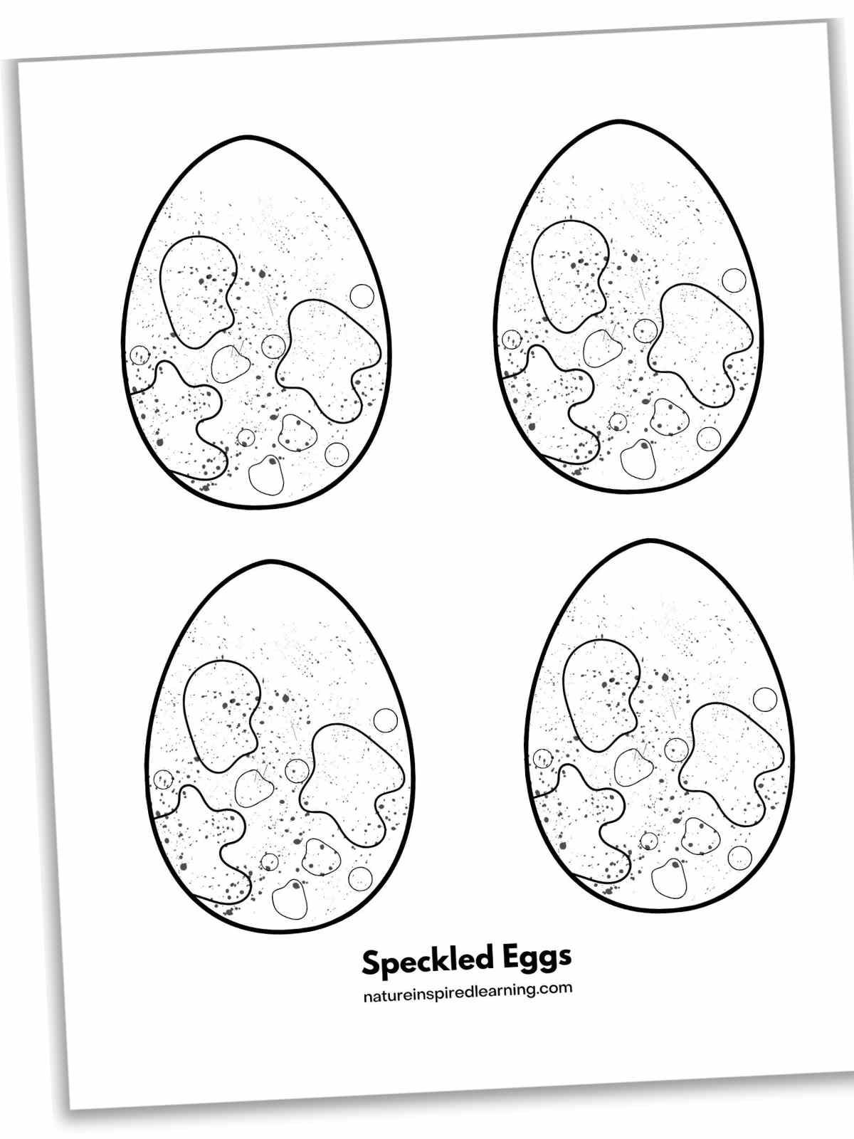 four eggs arranged in two rows of two each egg has a random speckled design