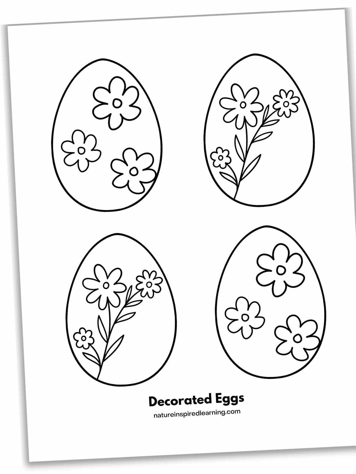 Four eggs arranged in two rows of two with flowers and flower stem designs on each