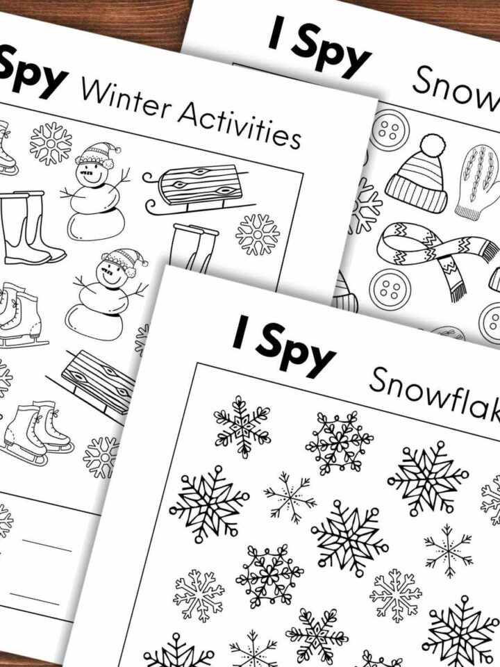 Three overlapping winter I spy printables with different black and white designs including snowman, snowflakes, and winter activities.